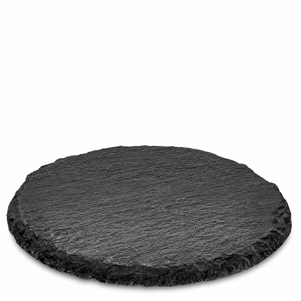 Plateau rond en ardoise noire de 15 cm de diamètre comme plat de service avec une structure de pierre naturelle et un bord rugueux
