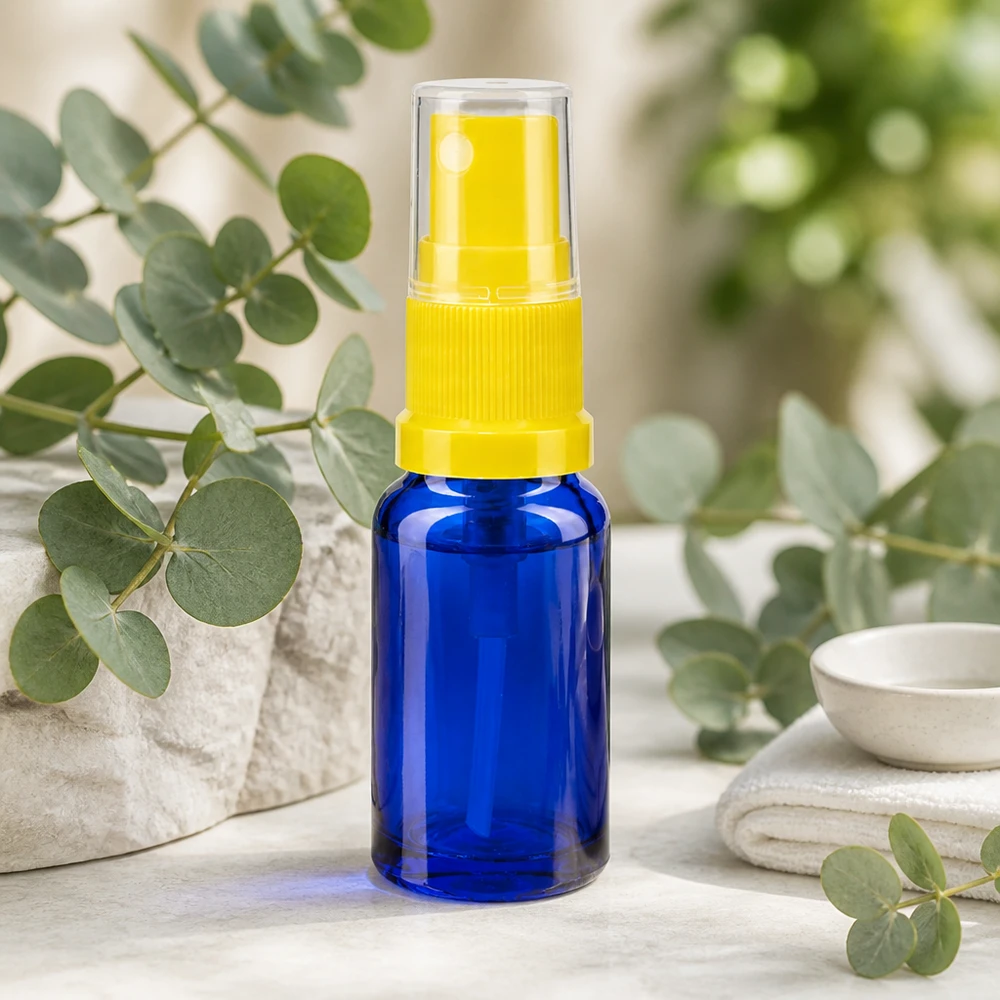 Flacon de pharmacie bleu 30ml embout spray jaune Flacon pulvérisateur en verre bleu de 30 ml, de type pharmacie, muni d'un vaporisateur jaune et d'un capuchon de protection transparent