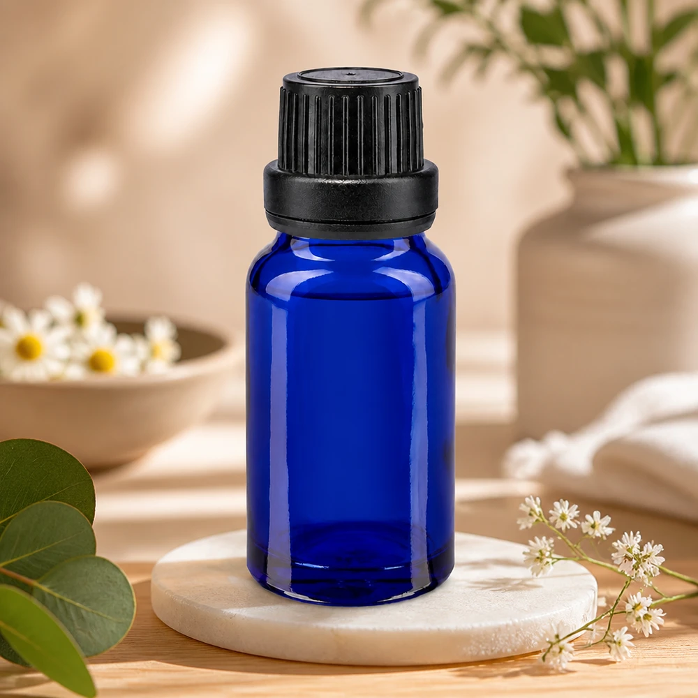 Flacon de pharmacie bleu de 10 ml avec bouchon d'inviolabilité noir et compte-gouttes de précision de 2 mm pour l'aromathérapie