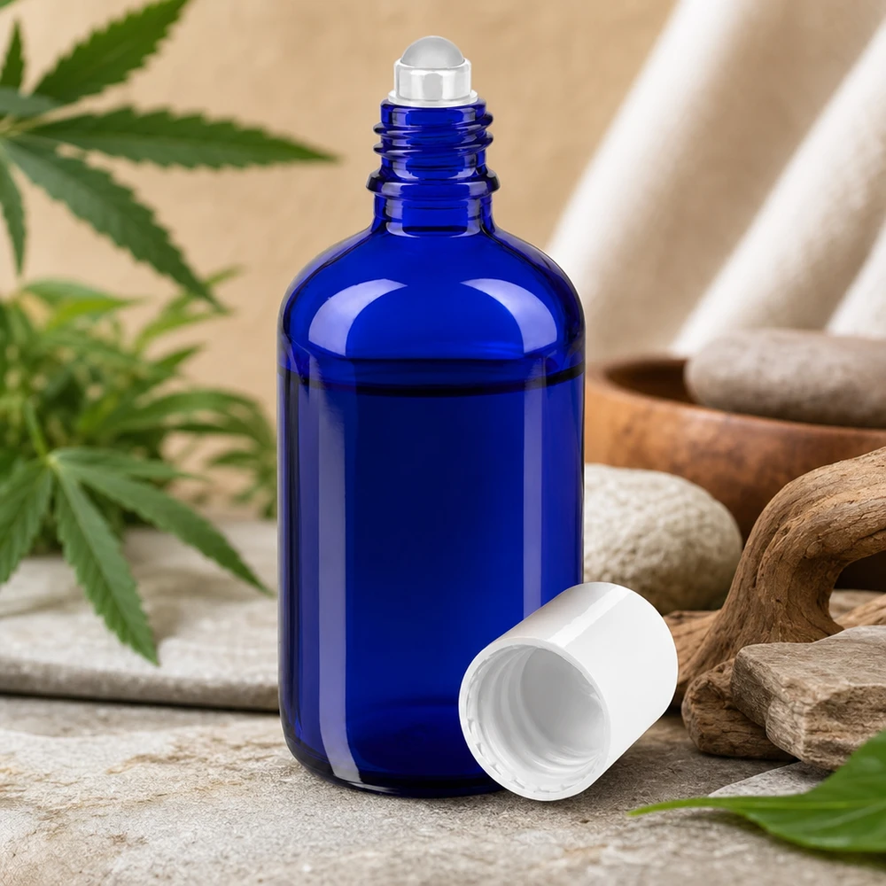 Flacon roll-on en verre d'apothicaire bleu de 100 ml, orné de pierres naturelles et de feuilles de cannabis