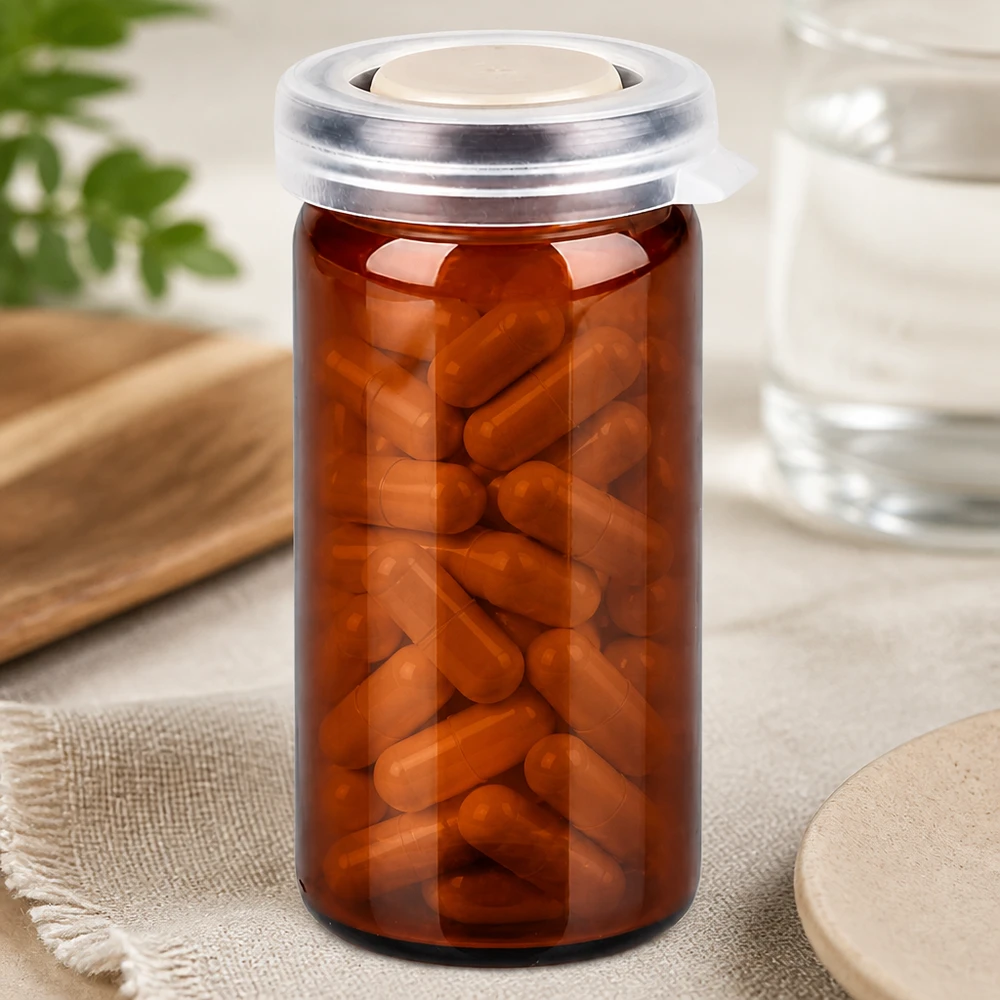 Flacon de pharmacie de 10 ml en verre ambré avec couvercle à encliqueter, rempli de gélules brunes