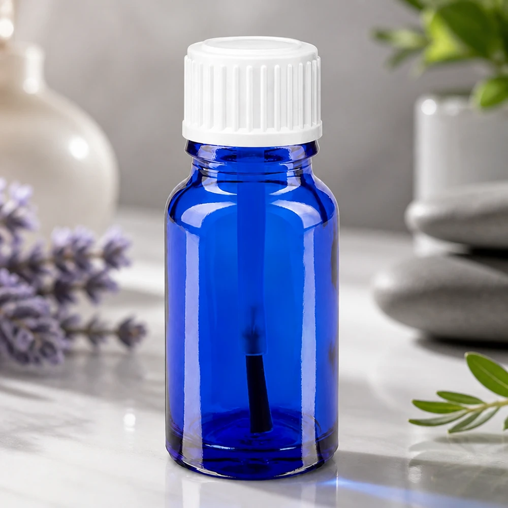 Flacon à pinceau bleu cobalt de 10 ml, en verre de qualité pharmaceutique, muni d'un bouchon blanc à sécurité enfants