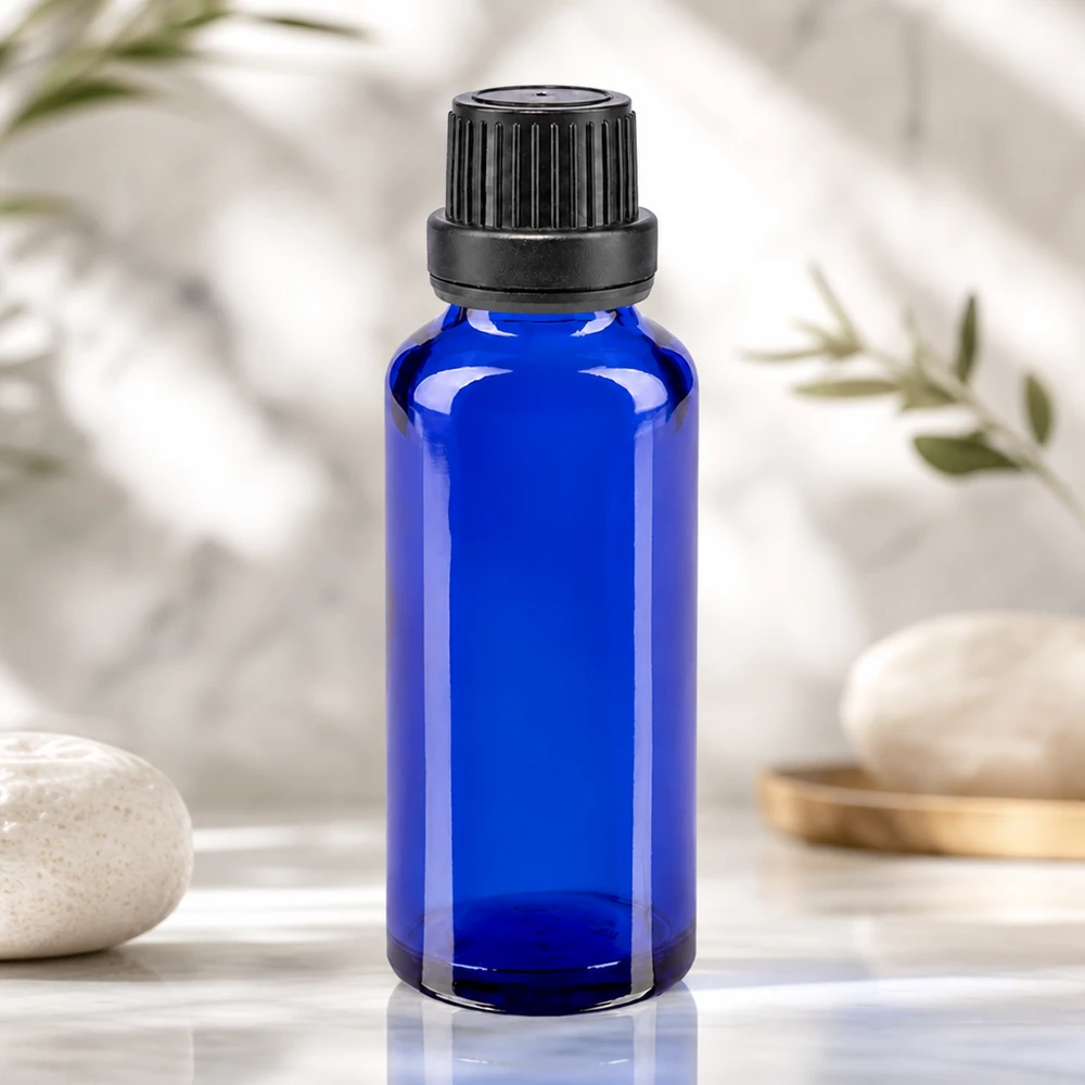 Flacon de pharmacie bleu 30ml bouchon vissable noir bouchon inviolabilité Petit flacon de pharmacie de 30 ml en verre bleu cobalt, muni d'un bouchon à vis noir à sécurité enfant